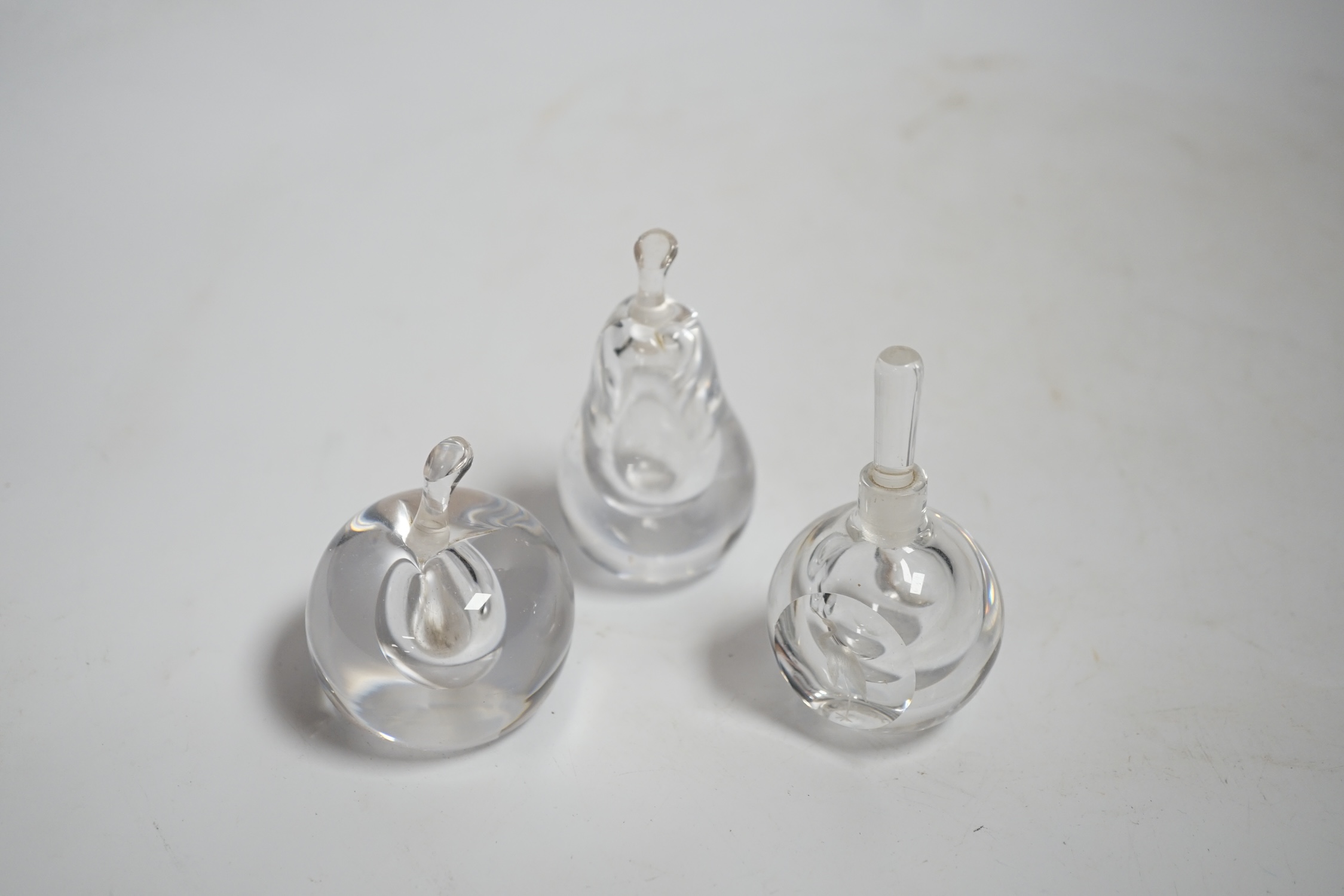 Three Vicke Lindstrand for Kosta Boda glass perfume bottles, tallest 7.5cm